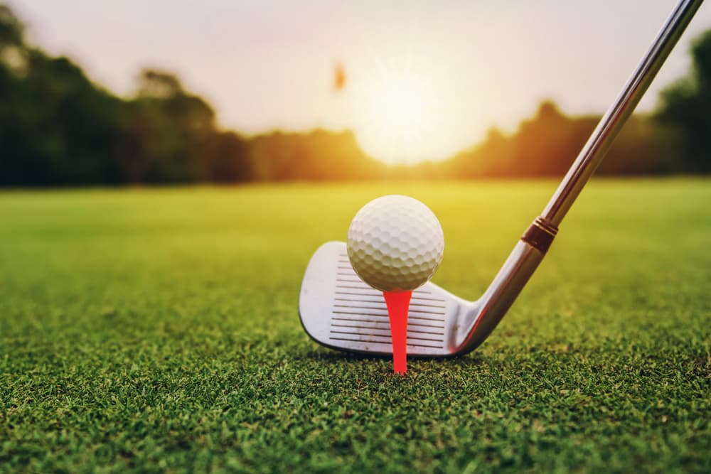 closeup-golf-club-ball-on-green-grass