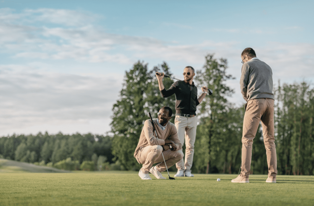 group of friends enjoying golf and providing tips about how to play golf